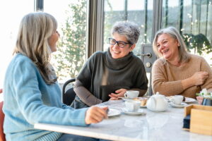 The Gardens at Quail Springs | Senior women drinking tea and laughing together