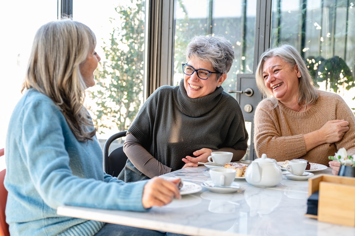 The Gardens | Senior women drinking tea and laughing together